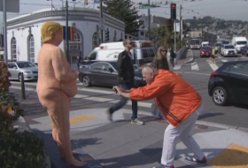 Everywhere you look, there`s a large naked statue of Donald Trump